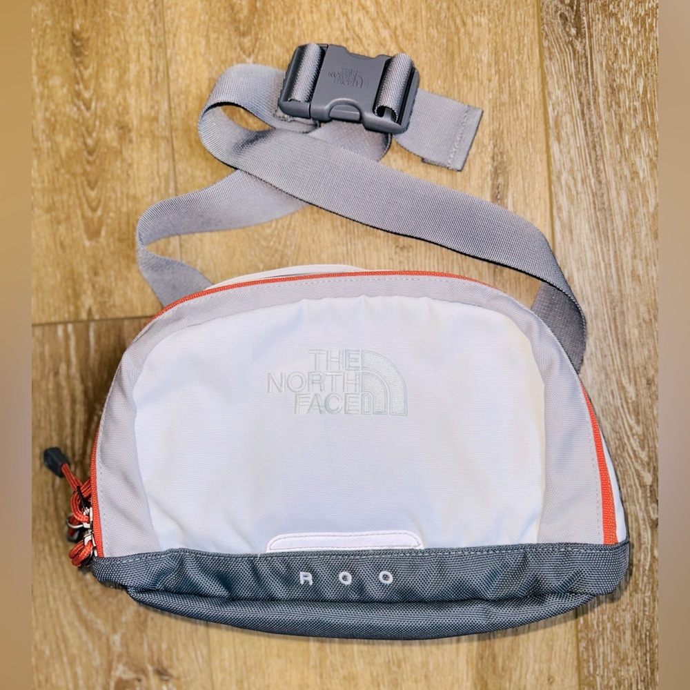 The North Face White and Orange Belt Bag with Minimalist Design